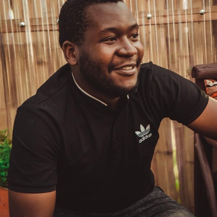 Alex Rivera, Lead Design Curator at BeaconSummerCanyon, reviewing corporate floral arrangements